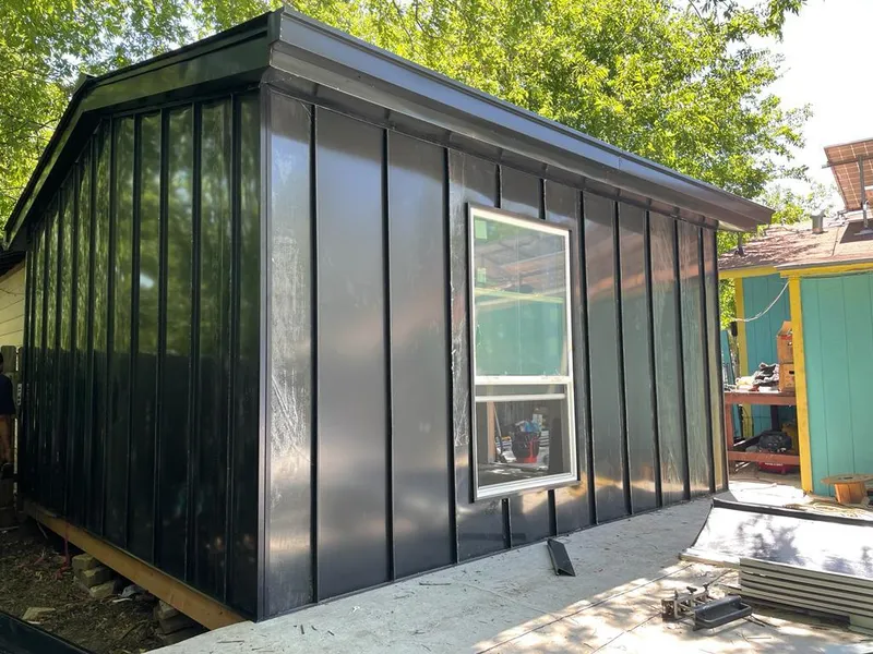 Black standing seam metal wall panels for Roof Inspection in Long View